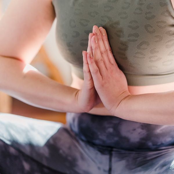 Person in a calm, balanced pose, showing focus and serenity.